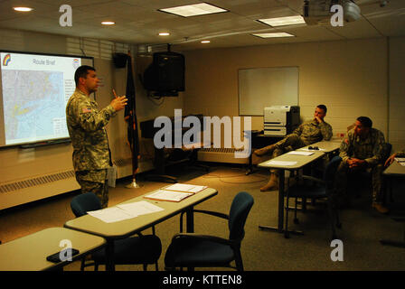 N.Y. Army National Guard Soldiers assigned to 3rd Battalion, 142nd Aviation receive a briefing on their upcoming mission in Latham, N.Y., Sept 10, 2017. The 3rd Battalion, 142nd Aviation was preparing to deploy to Florida to bring aid to the victims of Hurricane Irma. (U.S. Army National Guard photo by Pfc. Andrew Valenza) Stock Photo