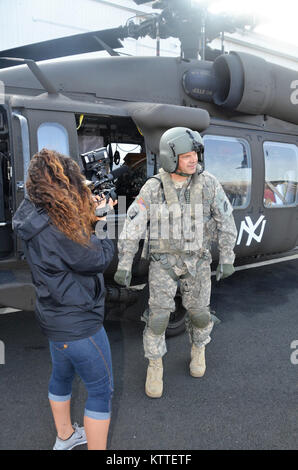 Ronkonkoma, NY - Aircrews of the New York Army National Guard’s Company B, 3rd Battalion, 142nd Aviation Regiment prepare for takeoff and deployment from Long Island MacArthur Airport, Islip, N.Y. to Florida in support of the Guard response to Hurricane Irma September 11, 2017.    Ten UH-60 Blackhawk helicopters and 55 aircrew members and maintainers deployed from three flight facilities across the state to support the Florida Army National Guard. U.S. National Guard photo by Capt. Mark Getman, New York Guard. Stock Photo