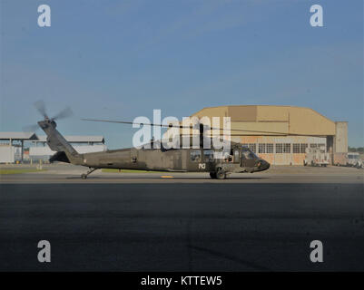 Ronkonkoma, NY - Aircrews of the New York Army National Guard’s Company B, 3rd Battalion, 142nd Aviation Regiment prepare for takeoff and deployment from Long Island MacArthur Airport, Islip, N.Y. to Florida in support of the Guard response to Hurricane Irma September 11, 2017.    Ten UH-60 Blackhawk helicopters and 55 aircrew members and maintainers deployed from three flight facilities across the state to support the Florida Army National Guard. U.S. National Guard photo by Capt. Mark Getman, New York Guard. Stock Photo