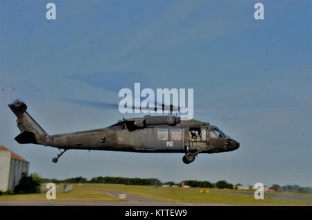 Ronkonkoma, NY - Aircrews of the New York Army National Guard’s Company B, 3rd Battalion, 142nd Aviation Regiment prepare for takeoff and deployment from Long Island MacArthur Airport, Islip, N.Y. to Florida in support of the Guard response to Hurricane Irma September 11, 2017.    Ten UH-60 Blackhawk helicopters and 55 aircrew members and maintainers deployed from three flight facilities across the state to support the Florida Army National Guard. U.S. National Guard photo by Capt. Mark Getman, New York Guard. Stock Photo