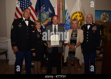David McAvinney receives an award for five years of dedication to the Association of the United States Army(AUSA) through his company McAvinney Builders, LLC, during the AUSA Soldier Recognition dinner, in Albany, N.Y., Sept. 23, 2017. Contributors received awards from the AUSA due to their contributions to the association, and to the U.S. Army. (N.Y. Army National Guard photo by Pfc. Andrew Valenza) Stock Photo