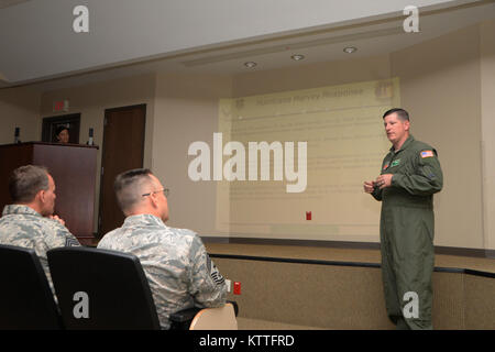 Chief Master Sgt. Harold L. Hutchison, command chief of the North American Aerospace Defense Command and U.S. Northern Command, coins Airmen at New York Air National Guard's 106th Rescue Wing, Westhampton Beach, New York on October 3, 2017. Chief Hutchison thanked the members of the 106th for their hard work and dedication to saving lives during the Hurricane Harvey and Hurricane Irma relief efforts. (U.S. Air National Guard photo by Airman 1st Class Daniel H. Farrell) Stock Photo