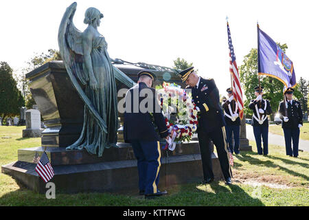 Major General Raymond Shields, commander of the New York Army National Guard; right, and New York Army National Guard Command Sgt. Major David Piwowarski place a wreath at the grave of Chester A. Arrthur, president of the United States from 1881 to 1885 during a ceremony in Albany Rural Cemetery in Menands, N.Y. on Oct. 5, 2017 . The United States Military honors deceased presidents with a wreath from the sitting president at their gravesite on the anniversary of the past president's birth. ( New York State Division of Military and Naval Affairs photo by William Albrecht) Stock Photo