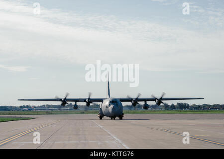 A WC-130 from the 156th Airlift Wing, Muñiz Air National Guard Base, Puerto Rico, arrives here at the Niagara Falls Air Reserve Station to load cargo to deliver to Puerto Rico, NFARS, N.Y., Oct. 19, 2015. The cargo is going with 125 members of the 152nd Engineer Support Company, New York Army National Guard, to work on such things as debris removal and restore lines of communication to bring aid in the on going hurricane relief. (Air National Guard photo by Staff Sgt. Ryan Campbell) Stock Photo