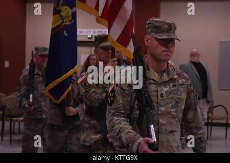 N.Y. Army National Guard Soldiers from the 501st Ordnance (EOD) Battalion, present the colors for a Change of Command Ceremony in Glenville, N.Y., Oct. 21, 2017. The 501st was transitioning the role of commander from Lt. Col. Jason Souza to Maj. Henry Padley. (N.Y. Army National Guard photo by Spc. Andrew Valenza) Stock Photo