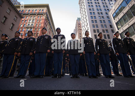 Soldiers from the 77th Sustainment Brigade out of Fort Dix, New Jersey stand at attention shortly before joining the march during the New York City Veteran's Day Parade Nov 11, 2017. This year the United States Air Force was honored as the &quot;Featured Service&quot; during the parade.  With more than 40,000 participants, the New York City Veterans Day Parade is the largest Veterans Day event in the United States.   Air National Guard Photo by Staff Sgt. Christopher S. Muncy Stock Photo