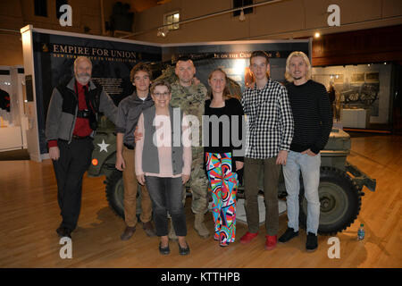 New York Army National Guard Soldier Lt. Col. Todd Balog( left), commander of the Special Troops Battalion,  poses with his family after his promotion ceremony at the New York State Military Museum in Saratoga Springs, N.Y., December 8, 2017. Balog is an Afghanistan veteran and resident of Saratoga Springs, N.Y.   (U.S. Army National Guard photo by Capt. Jean Marie Kratzer) Stock Photo