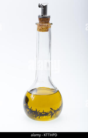 Thyme infused olive oil over white background Stock Photo