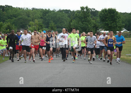 Dozens of National Guard and community runners participate in the 4th 'Hometown Heroes Run', a fundraiser sponsored by the New York National Guard Family Readiness Council on Sunday, June 12th at Colonie Crossings Park. Stock Photo