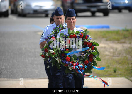 Members of the 106th Rescue Wing lay wreaths in rememberence of seven airmen from the wing who lost their lives in a crash on June 13, 1979. Captain John Speir, Captain John Kleven, Master Sergeant Al Snyder, Tech Sergeant Ralph Tommasone, Tech Sergeant Ronald Allen , Staff Sergeant Scott Hursh and Staff Sergeant David Lambert died when their helicopter crashed during inclement weather.  (Senior Airman Christopher Muncy / Released) Stock Photo