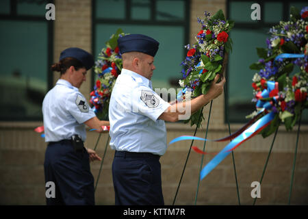 Members of the 106th Rescue Wing lay wreaths in rememberence of seven airmen from the wing who lost their lives in a crash on June 13, 1979. Captain John Speir, Captain John Kleven, Master Sergeant Al Snyder, Tech Sergeant Ralph Tommasone, Tech Sergeant Ronald Allen , Staff Sergeant Scott Hursh and Staff Sergeant David Lambert died when their helicopter crashed during inclement weather.  (Senior Airman Christopher Muncy / Released) Stock Photo