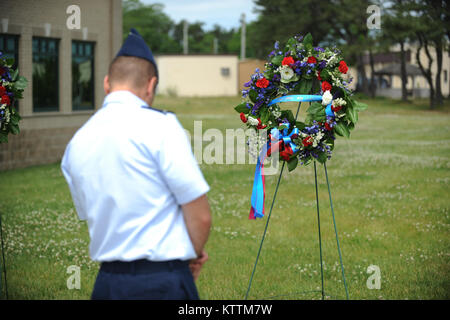 Members of the 106th Rescue Wing lay wreaths in rememberence of seven airmen from the wing who lost their lives in a crash on June 13, 1979. Captain John Speir, Captain John Kleven, Master Sergeant Al Snyder, Tech Sergeant Ralph Tommasone, Tech Sergeant Ronald Allen , Staff Sergeant Scott Hursh and Staff Sergeant David Lambert died when their helicopter crashed during inclement weather.  (Senior Airman Christopher Muncy / Released) Stock Photo