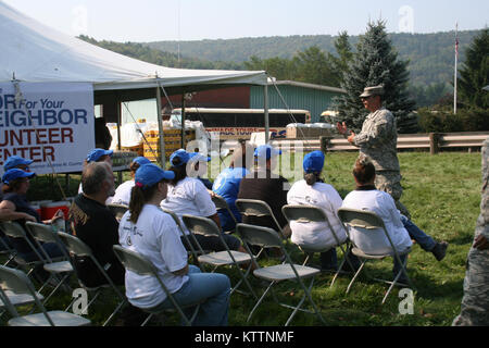 New York Army National Guard Sgt. 1st Class Frank Rizzi briefs volunteers before missions in Prattsville, N.Y. Sep. 4. Photo by Lt. Col. Richard Goldenberg, NY Army National Guard. Stock Photo