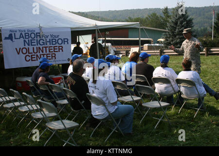 New York Army National Guard Sgt. 1st Class Frank Rizzi briefs volunteers before missions in Prattsville, N.Y. Sep. 4. Photo by Lt. Col. Richard Goldenberg, NY Army National Guard. Stock Photo