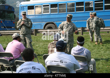 New York Army National Guard Sgt. 1st Class Frank Rizzi briefs volunteers before missions in Prattsville, N.Y. Sep. 4. Photo by Lt. Col. Richard Goldenberg, NY Army National Guard. Stock Photo