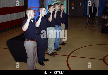 LATHAM- Five new recruits to the New York Army National Guard take the oath of enlistment on Tuesday, Dec. 13, 2011 at a ceremony honoring the 375th Birthday of the National Guard. The Adjutant General of New York, Major General Patrick Murphy,administered the oath to privates Haley Young, Michael Patterson, Shelbi Vanderbogart, Eric Petersone and Donald Pestuglicci. Stock Photo