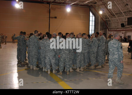 Hancock Field Air National Guard Base-- Soldiers gather together prior to the  mobilization ceremony for Soldiers fo the 27th Special Troops Battalion, the 427th Brigade Support Battalion and Headquarters of the 27th Infantry Brigade Combat Team here on Sunday, Jan. 29 Stock Photo