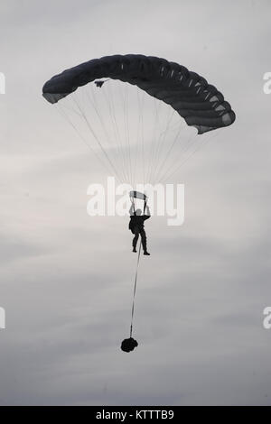 WESTHAMPTON BEACH, NY - Pararescue Jumpers and Combat Rescue Officers with the 103rd Rescue Squadron conduct tandem jump training with Col Robert Landsiedel, 106th Rescue Wing's executive officer.  (USAF/Senior Airman Christopher Muncy/released) Stock Photo