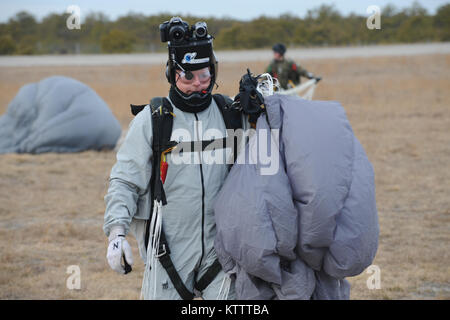 WESTHAMPTON BEACH, NY - Pararescue Jumpers and Combat Rescue Officers with the 103rd Rescue Squadron conduct tandem jump training with Col Robert Landsiedel, 106th Rescue Wing's executive officer.  (USAF/Senior Airman Christopher Muncy/released) Stock Photo