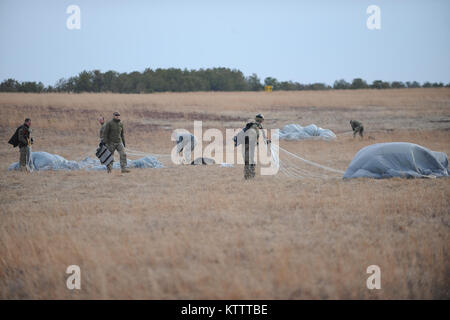 WESTHAMPTON BEACH, NY - Pararescue Jumpers and Combat Rescue Officers with the 103rd Rescue Squadron conduct tandem jump training with Col Robert Landsiedel, 106th Rescue Wing's executive officer.  (USAF/Senior Airman Christopher Muncy/released) Stock Photo