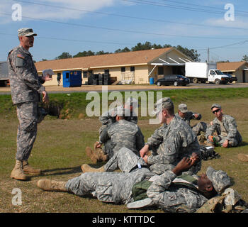 CAMP SHELBY, MS -- Soldiers of A Company, 4-118th Infantry Battalion treat mock casualties during a Combat LifeSaver class here Feb. 9. Combat Lifesavers are non-medical Soldiers who provide lifesaving measures as a secondary mission as their primary and combat missions allow. The battalion is part of the 27th Infantry Brigade Combat Team, and brigade troops are here preparing to deploy overseas. (photo by Sgt. First Class Raymond Drumsta, 27th IBCT Public Affairs) Stock Photo