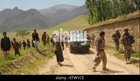 Soldiers of the 37th Infantry Brigade Combat Team, 6th Kandak Afghan Border Police, and villagers of Khwahan, Badakhshan Province, Afghanistan, walk along a dirt road toward the center of the village, June 3, 2012. (37th IBCT photo by Sgt. Kimberly Lamb) (Released) Stock Photo