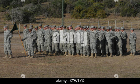 12612-A-YK528-006GUANTANAMO Bay, Cuba (June 12, 201) -- New York Army National Guard Citizen-Soldiers of the 107th Military Police Company completed a nearly one-year deployment to Joint Task Force-Guantanamo this month. In a Transfer of Authority ceremony 1st. Lt. Andrew Mill stands in front of the unit during the ceremony marking the exchange of the external security mission to the 755th MP Co., Puerto Rican Army National Guard on June 12, 2012.(U.S. Army photo by Sgt. 1st Class Kryn P. Westhoven/Released) Stock Photo