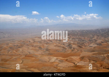 An aerial view from the window of a Blackhawk helicopter between Kunduz, Kunduz Province, and Khawajah Bahawuddin, Badakhshan Province, Afghanistan, June 27, 2012. (37th IBCT photo by Sgt. Kimberly Lamb) (Released) Stock Photo