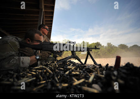 WESTHAMPTON BEACH, NY - Pararescue Jumpers and Combat Rescue Officers with the 103rd Rescue Squadron train with the M249 and M240 machinge guns, M203A2 grenade launcher, and Barrett rifle at the firing range on July 12, 2012. Stock Photo