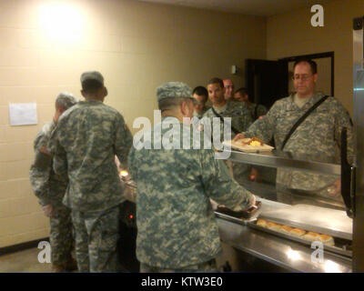 FORT DRUM New York Army National Guard Soldiers of the 369th Sustainment Brigade assigned to &quot;Task Force Sustain &quot; serve breakfast to 101 Expeditionary Signal Battalion Soldiers just prior to starting their day of training on Hand Grenades (dummy/inert grenades) and Life Saving Measures here on July 18. ( US Army Photo by Capt. Michael Ortiz, New York Army National Guard/ released) Stock Photo