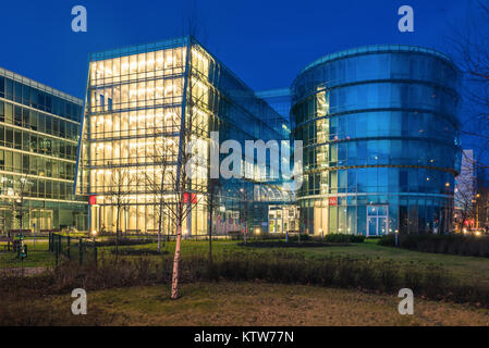 GDYNIA, POLAND - December, 26, 2017: Modern architecture with facades  made of glass in Gdynia by night. Stock Photo
