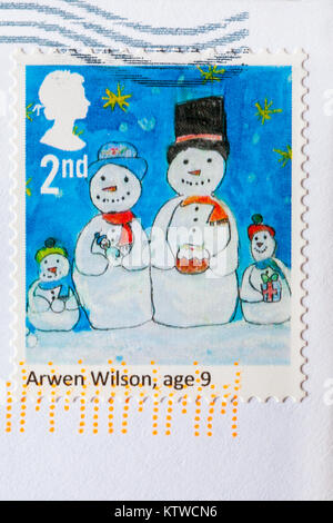 2nd class Christmas stamp with snowmen on stuck on envelope Stock Photo