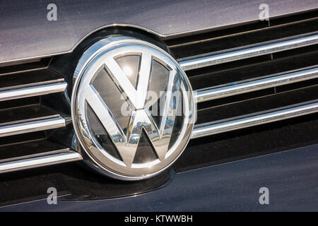 Volkswagen VW plate logo on a car grill. Volkswagen is a famous European car manufacturer company based on Germany Stock Photo