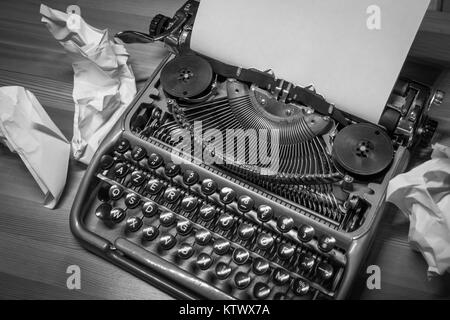 Typewriter ready for use with blank paper installed Stock Photo