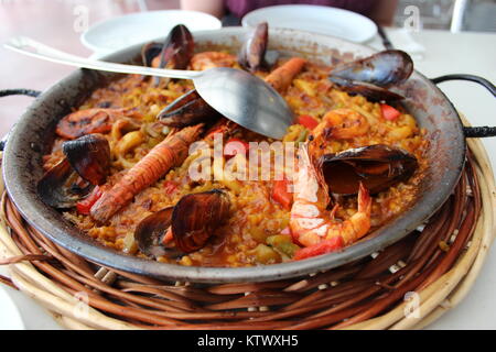 Dinner for two: Sea food Paella in Barcelona Stock Photo