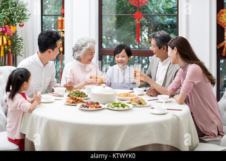 Happy family having Chinese New Year dinner Stock Photo