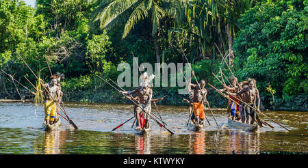 Canoe war ceremony of Asmat people. Headhunters of a tribe of Asmat . New Guinea Island, Stock Photo