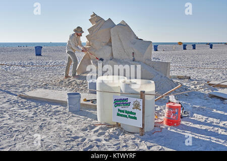 Sand sculpture being build by contestant in Sanding Ovation sand sculpture contest or festival on Treasure Island, beach, Florida, USA. Stock Photo