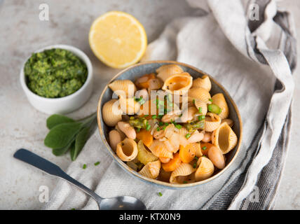 Pasta Shells Served with White Beans and Pesto Stock Photo