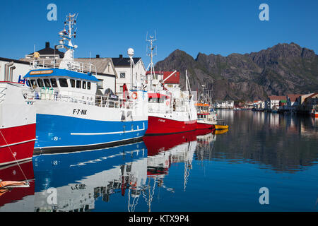 Henningsvaer, Norway - August 19,2017: Picturesque fishing port in Henningsvaer on Lofoten islands, Norway with typical red wooden buildings and small Stock Photo