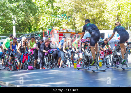 Zamora, Spain - September 02, 2017: People perform a spinning session outdoors in an urban park. Cycle Against Cancer. Organized by the Spanish Associ Stock Photo
