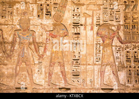 Reliefs on the walls of the Second Court, Temple of Ramesses III at Medinet Habu, West Bank, UNESCO World Heritage Site, Luxor, Egypt, North Africa, A Stock Photo