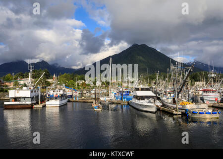 Crescent Boat harbour with beautiful wooded mountains and town of Sitka, rare sunny day, summer, Baranof Island, Alaska, United States of America, Nor Stock Photo