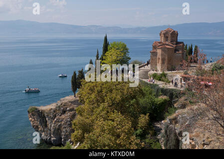 Boats by St. John Kaneo church on Lake Ohrid, UNESCO World Heritage Site, Macedonia, Europe Stock Photo