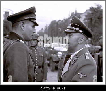 WW2 Head of the SS Heinrich Himmler (right), one of the chief architects of the Holocaust, speaks with an unidentified officer in Warsaw after German invasion of Poland, 1939 .REICHSFÜHRER HEINRICH HIMMLER Heinrich Luitpold Himmler (7 October 1900 – 23 May 1945) was Reichsführer of the Schutzstaffel (SS), a military commander, and a leading member of the Nazi Party (NSDAP) of Nazi Germany. Stock Photo