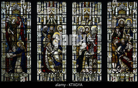 Stained glass window by Powell & Sons depicting Scenes from the early life of Jesus Christ, St Mary's Church, Stratford St Mary, Suffolk, England Stock Photo