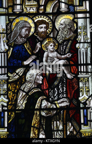 Stained glass window by Powell & Sons depicting Presentation in the temple, St Mary's Church, Stratford St Mary, Suffolk, England; Stock Photo