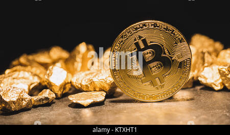 cryptocurrency Bitcoin and mound of gold nuggets - Business concept image Stock Photo