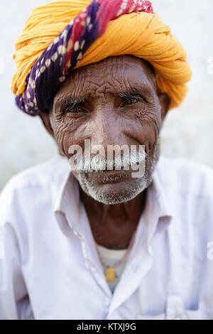Portrait of senior Indian man wearing colorful turban, village near Pushkar, India. Stock Photo