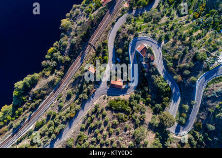 Aerial view of a winding road and train tracks along the Tagus River near the village of Belver in Portugal; Concept for travel in Portugal Stock Photo